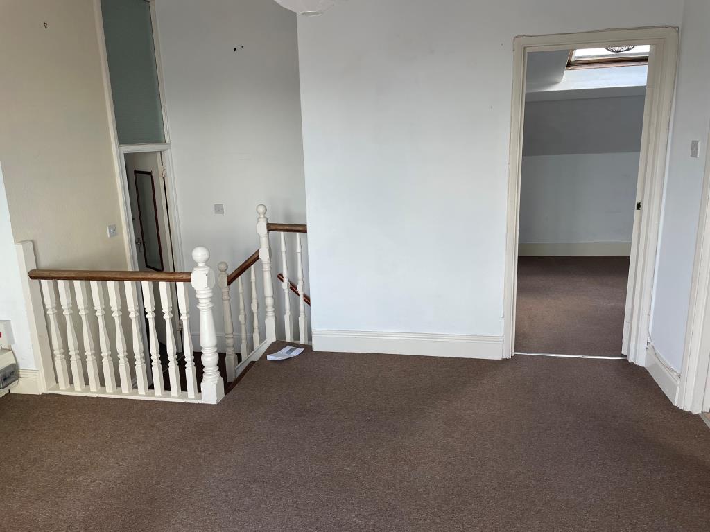 Lot: 54 - TOP FLOOR FLAT WITH ROOF TERRACE IN CITY CENTRE - View of living room from patio doors